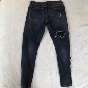 Dark blue jeans with holes